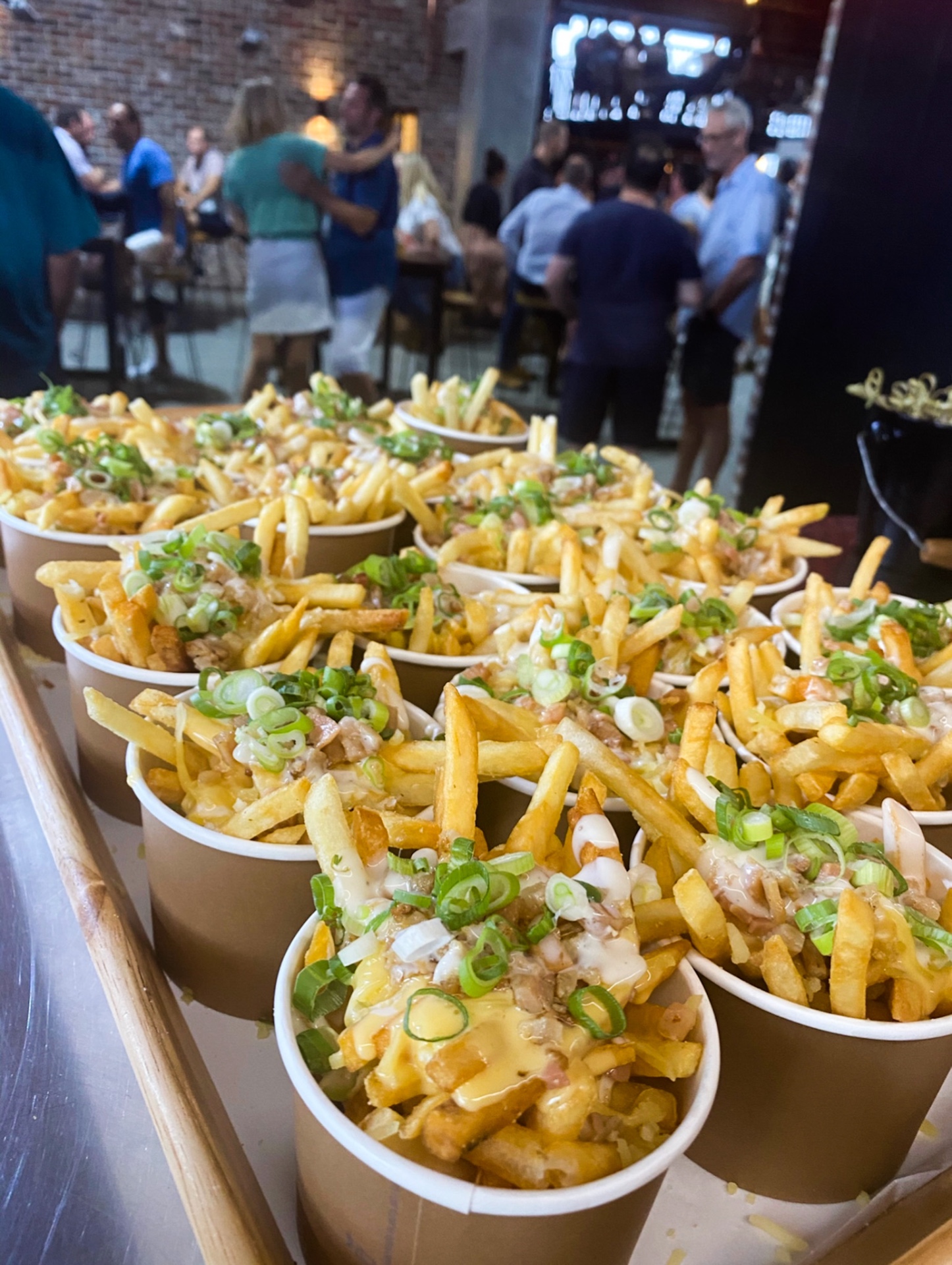 Loaded fries being served to guests at a Gold Coast catering event