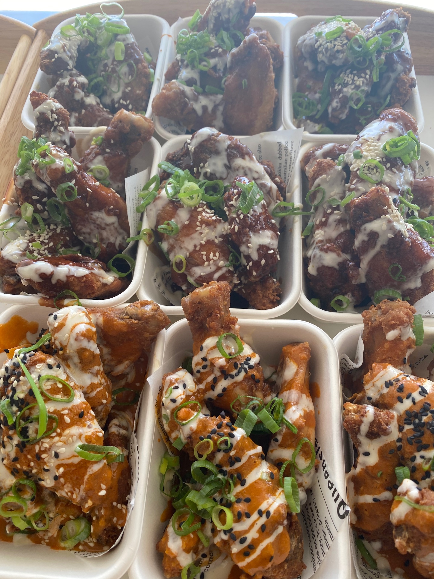 Buffalo and BBQ chicken wings ready to serve at a private function